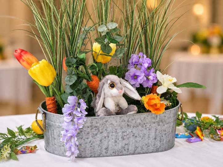 Fresh spring garden centerpiece in bright pastel tones.