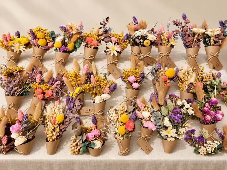 Collection of handcrafted mini bouquets wrapped in brown paper.