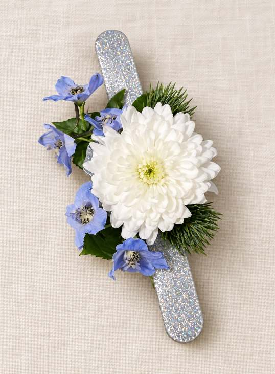 Second blue and white boutonniere with greenery and a twine wrap.